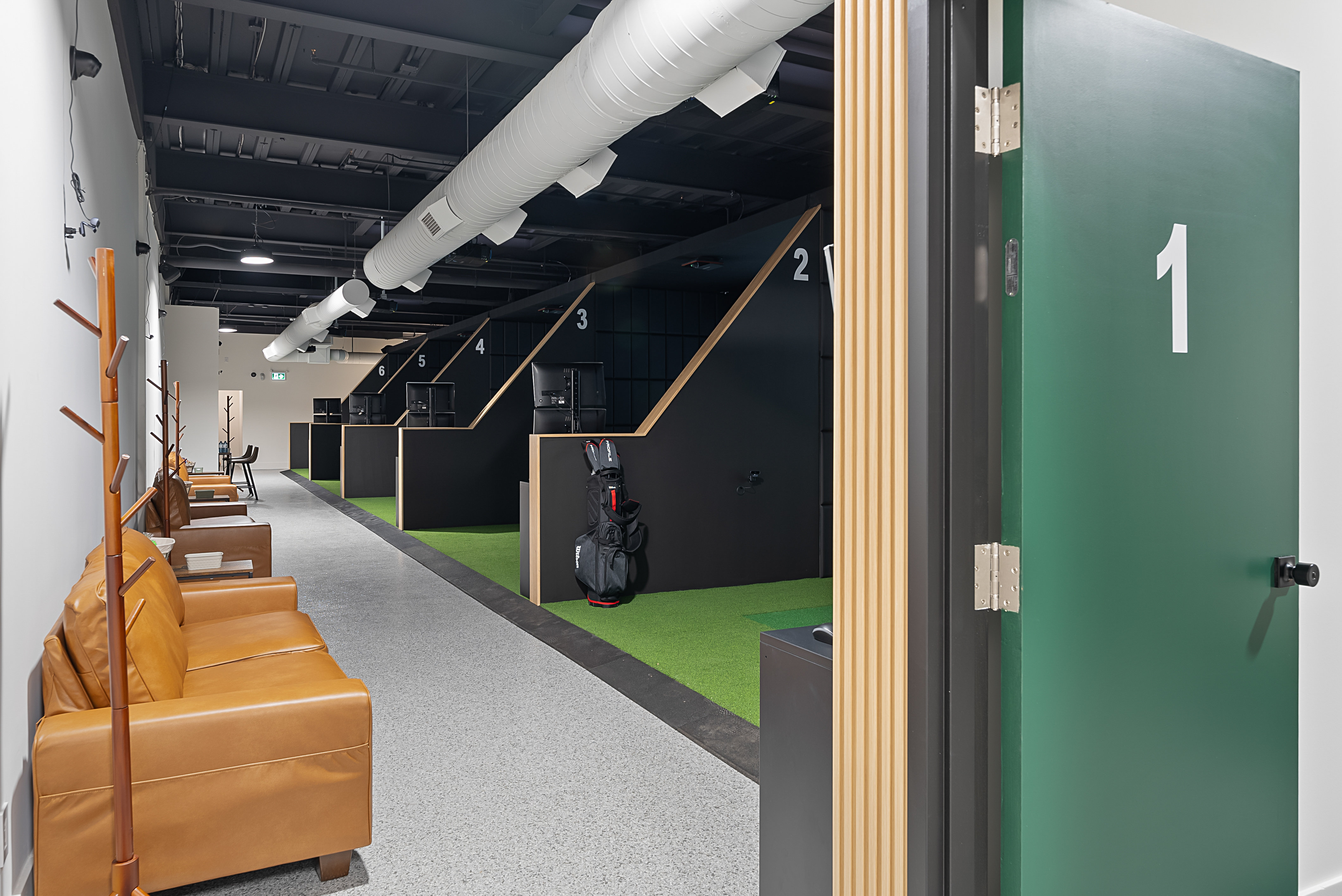 Entry view of the Shotgun Golf Leaside simulator bays